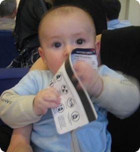 6 month old E eating his airline ticket