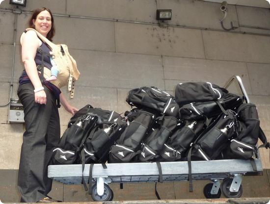 Debbie and Eilan loading gift bags onto a cart