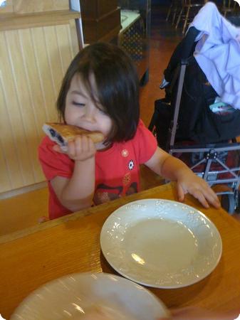 D enjoys a home baked scone at A Renaissance Cafe in Tacoma