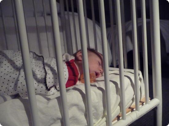 Eilan resting comfortably in a hotel crib