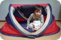 4 1/2 Year Old E squeezes in the PeaPod travel bed