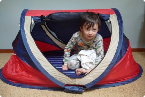 4 1/2 Year Old E squeezes in the PeaPod travel bed