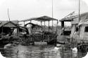 Kids outside their floating home in Phnom Penh, Cambodia