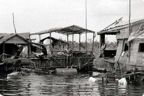 Kids outside their floating home in Phnom Penh, Cambodia