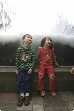 Waves crash down overhead as D and E sit in the "Wave Tunnel"