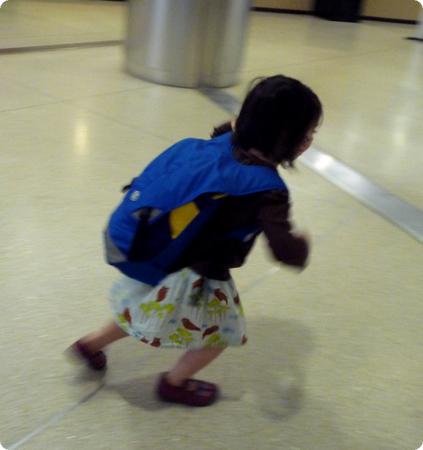 D runs through the airport to catch her flight