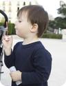 E blows bubbles at a park in Barcelona, Spain