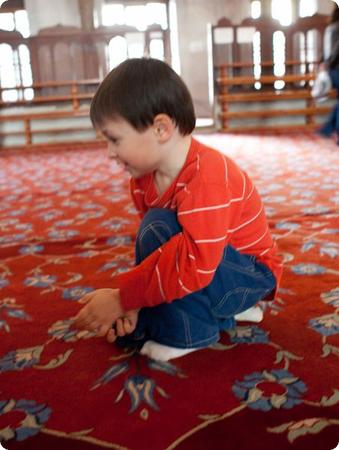 E hangs out on the carpet of the Blue Mosque in Istanbul