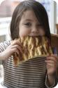 D enjoys fresh local bread at a restaurant in Istanbul