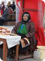 Woman selling pigeon feed outside of Istanbul's New Mosque 