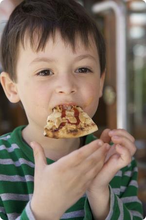 E munches on local bread slathered with peanut butter and jam