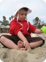 E explores the sand at Crystal Cove in Laguna Beach, CA