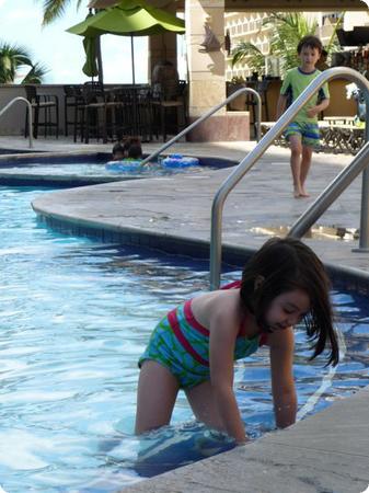 The kids enjoy the afternoon shade and the pool at the Embassy Suites Waikiki Beach Walk
