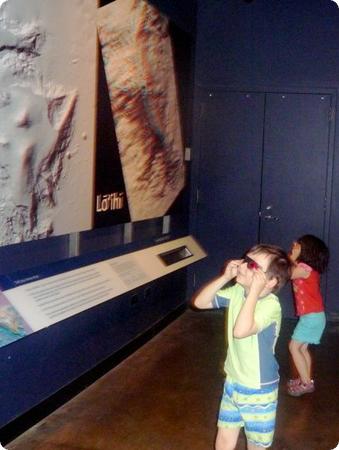 The kids don 3d glasses to check out an image of volcano Lo'ihi's crater