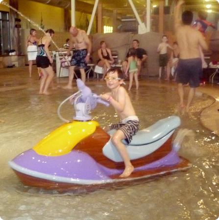 Everest on a "jetski" at Great Wolf Lodge. Don't worry, it doesn't move.