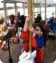 Darya hangs on tight on the Carousel at Yerba Buena in San Francisco