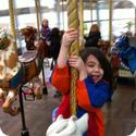 Darya hangs on tight on the Carousel at Yerba Buena in San Francisco