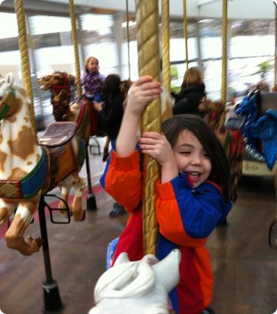 Darya hangs on tight on the Carousel at Yerba Buena in San Francisco