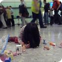 Darya spreads out her toys and plays in Heathrow's Baggage Claim Area