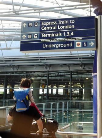 Darya gets a piggyback ride to the Heathrow Express.  Who do you think is more exhausted, her or dad?