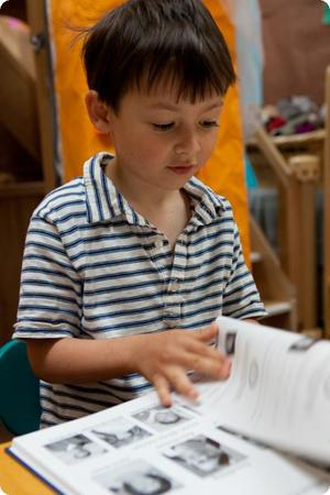 Everest signs a friend's pre-k yearbook