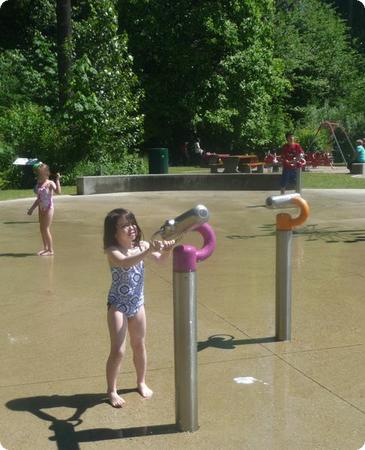 Darya sprays the other kids at Mahon Waterpark in North Vancouver