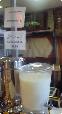 HUGE drink dispenser full of homemade dough (a slightly sour Persian yogurt drink)