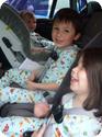 Three-across setup with all three kids in 5-point harness seats