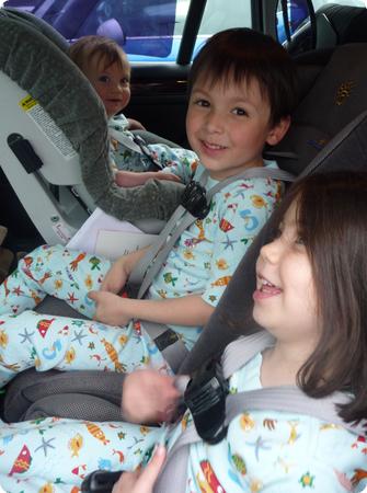 Three-across setup with all three kids in 5-point harness seats