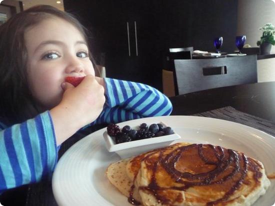 Darya just loves pancakes with chocolate syrup