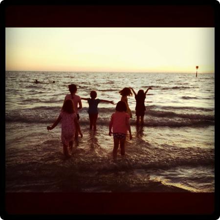 Running in the waves at sunset.