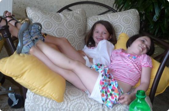 Darya cuddles up with a friend in our cabana at the Sandpearl Resort
