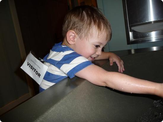 Washing hands before entering Auntie's beach house (dropoff childcare for kids 3+)