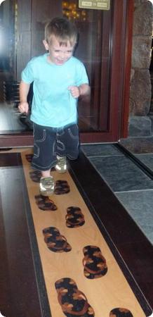 Eilan loved these little sandals, made of inlaid wood, at the entrance to Aulani's store