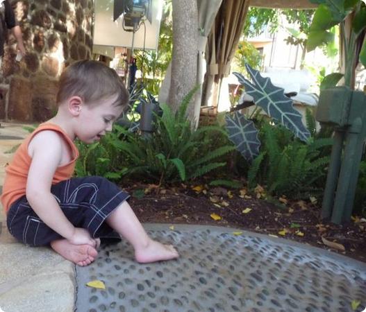 Eilan tests out the reflexology path at the Laniwai Spa at Aulani Resort