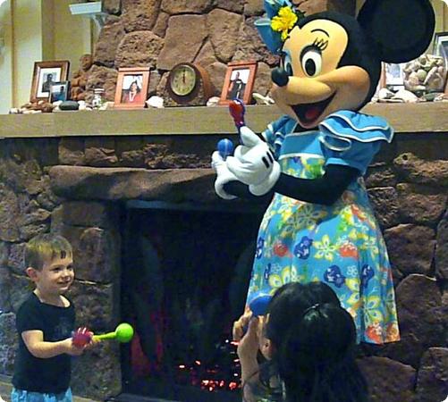 Eilan dances with Minnie Mouse during Disney Junior Aloha hour at Auntie's Beach House