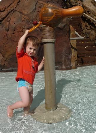 Eilan's too short to work the sprayer, but he loves playing with it anyway