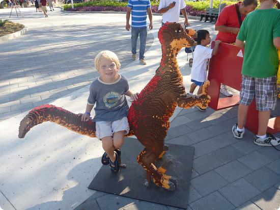 My 6 year old catches a ride on a Lego Dino at LEGOLAND FLORIDA