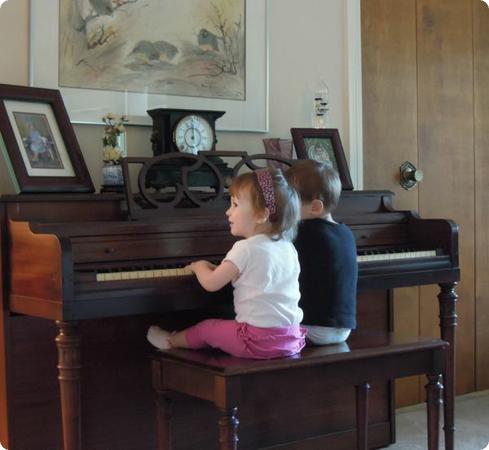 Eilan and his cousin play together on the piano that I learned music on