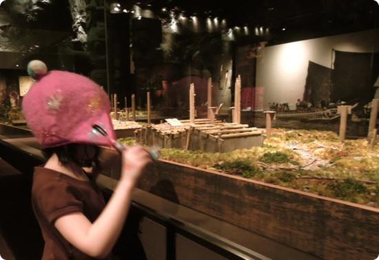 Darya checks out a model in the Royal BC Museum's First People exhibit
