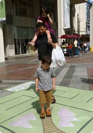 The kids enjoy a maze temporarily set up outside Westlake Center in Seattle