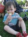 2 Year old Everest snacks on an ice cream cone at Seattle's Madison Park Beach