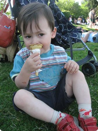 2 Year old Everest snacks on an ice cream cone at Seattle's Madison Park Beach