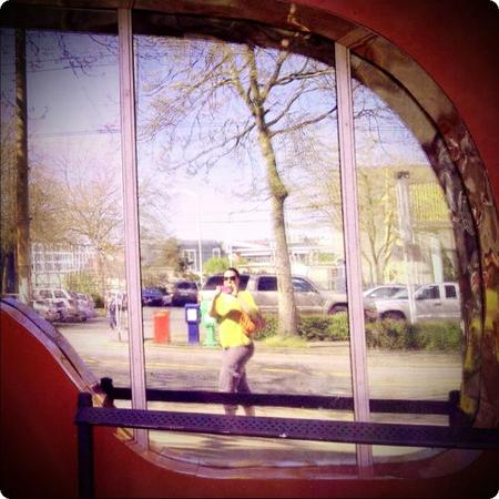 My reflection in an Experience Music Project Museum window