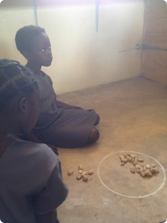 Traditional local games and European games are used in the library.  They teach counting, strategy and logic skills