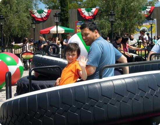 Everest and Peyman enjoying their ride at Luigi's Flying Tires