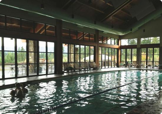 The indoor pool has a cozy lodge-like feel