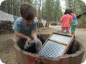 Eilan learns how to wash clothes the old fashioned way