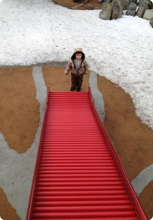 Eilan plays in the Accessible Playground in Whistler Village