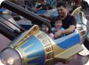Everest and his dad ride in Disneyland's Astro Orbiter